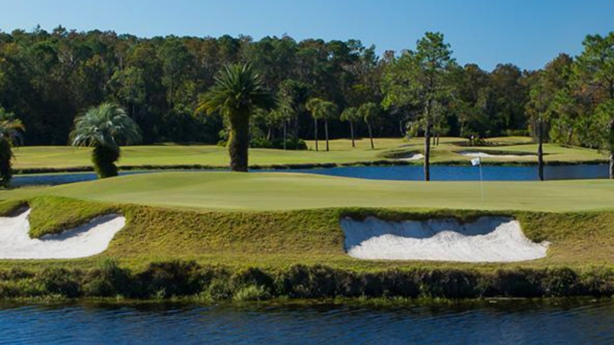 Bunkers and water in front of a green on Disney's Palm Golf Course