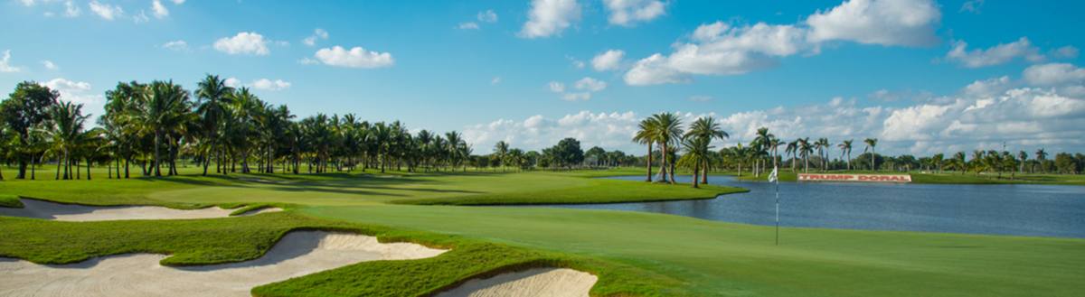 Bunkers and lake beside a green on the Blue Monster at Trump National Doral, one of the best golf courses in Florida