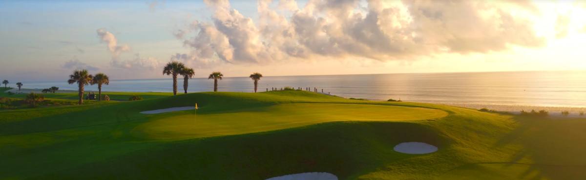 Ocean Course green above the Atlantic at sunrise at Hammock Beach, among the best golf courses in Florida